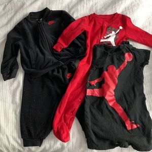 Lot of Air Jordan onesies and matching jumpsuit